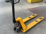 a yellow hand truck that is sitting on the ground