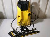 a close up of a yellow and black pressurer on a table
