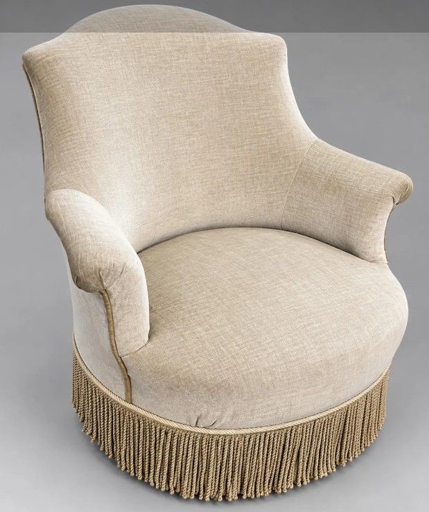 Fauteuil crapaud garni de velours