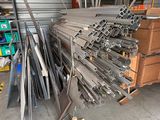 several pieces of metal are stacked on top of each other in a warehouse