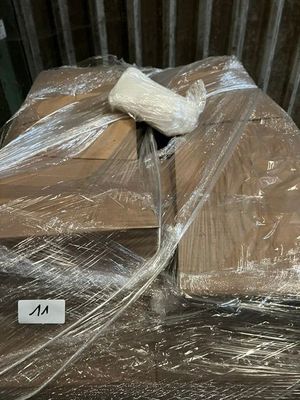 a pile of boxes wrapped in plastic and wrapped in plastic