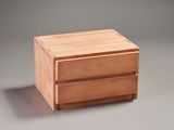 a small wooden box with two drawers on it