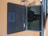 a laptop computer that is open on a desk
