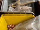 a yellow box filled with lots of different types of copper