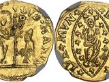 a gold coin with an image of a man and a woman on it