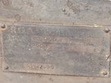 a close up of a piece of metal with a sign on it