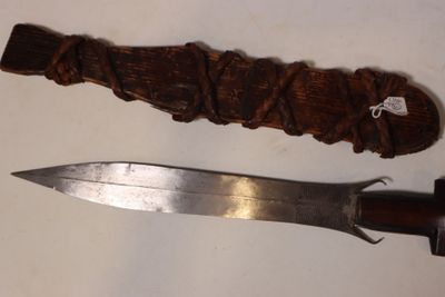 a knife and a knife holder on a table