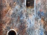 a painting of a rusted building with two windows