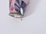 a can of soda sitting on top of a white table