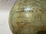 a large globe with a map on it sitting on a table