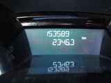 a digital clock on the dashboard of a car