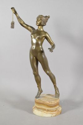 bronze statue of a woman holding a key in her right hand