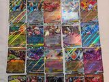 a pile of pokemon cards sitting on top of a table