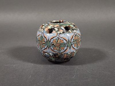 a small vase that is sitting on a table