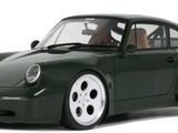 a green toy car that is sitting on a white surface