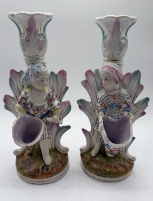 two vases sitting on top of each other on a table