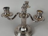 an image of a silver plated candelab with three candles