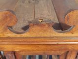 a wooden table with a wooden top and a wooden base