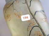a glass vase with a sticker on the side of it