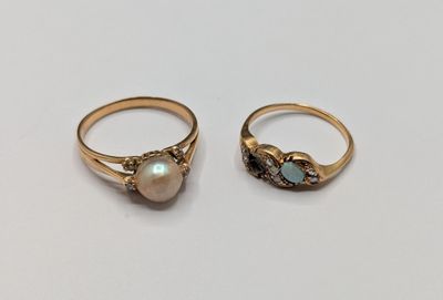 two gold rings with oplites and diamonds