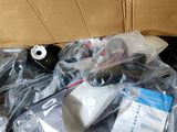a cardboard box filled with assorted items on a table