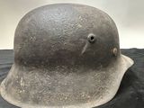 helmet on a black cloth on a table with a white background