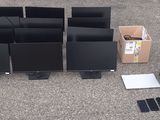 a lot of computer monitors and other electronics on the ground