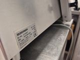 a machine that is sitting on a table in a kitchen