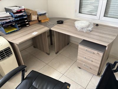 a desk with a chair and a computer on top of it
