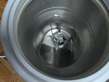 a metal sink with a metal bowl on top of it