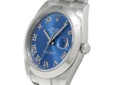 a close up of a wrist watch with roman numerals on it