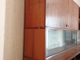 a fish tank in the middle of a wooden cabinet