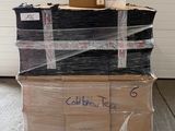 boxes stacked on top of each other on a pallet in a warehouse
