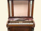 a piano that is sitting on top of a table