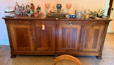 a wooden cabinet with a mirror on top of it
