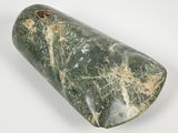 green marble cylinder with a hole in the middle on a white surface