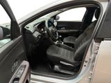 the interior of a car with the door open and the driver ' s seat up