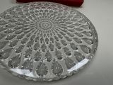 a glass plate with a decorative design on it