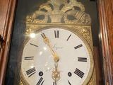 a clock that is sitting on the wall in the room
