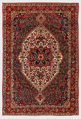a red and black rug with a medallion design on it