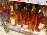many bottles of wine on the shelf in the store