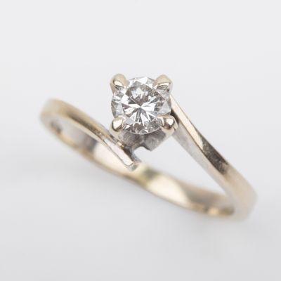 a close up of a diamond ring on a white background