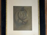 framed picture of a picture of a clock on a wooden wall