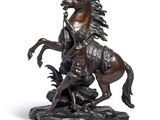 bronze statue of a man on a horse with a man on a horse
