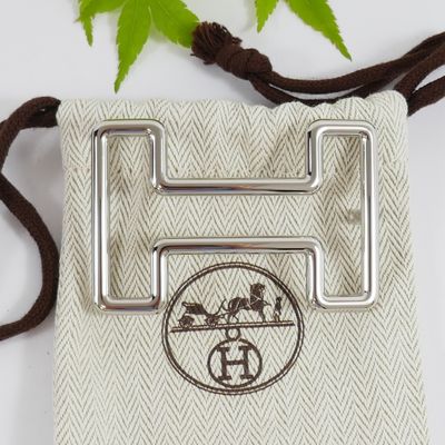 a small bag with a metal buckle on it