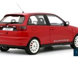 the red car is parked on a white surface with a white background