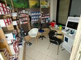 an image of a room with a lot of items on the shelves