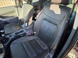 the interior of a car with black leather seats and a steering wheel
