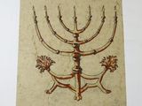 an old book with a drawing of a menorah on it