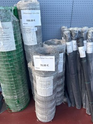 many rolls of plastic mesh on the shelf